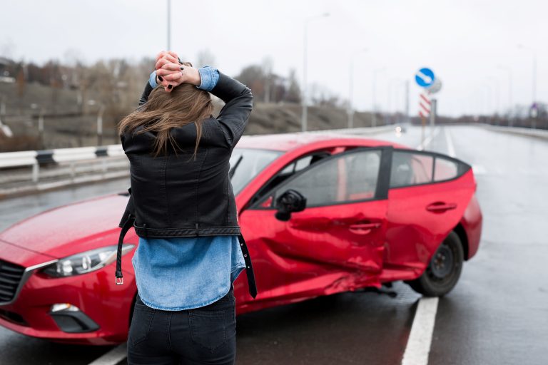 Woman Stands Near A Broken Car After An Accident Compressed